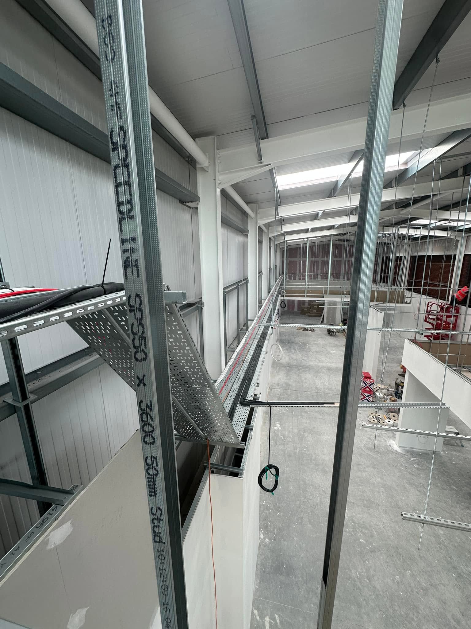 Cable containment installed high inside a large commercial building