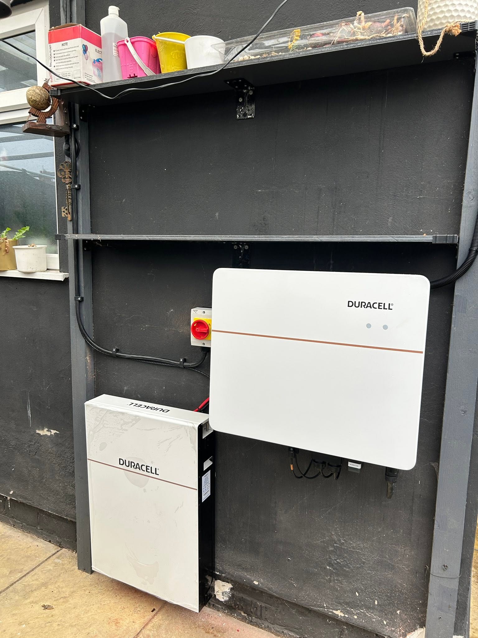 Duracell battery storage and inverter equipment installed on a wall