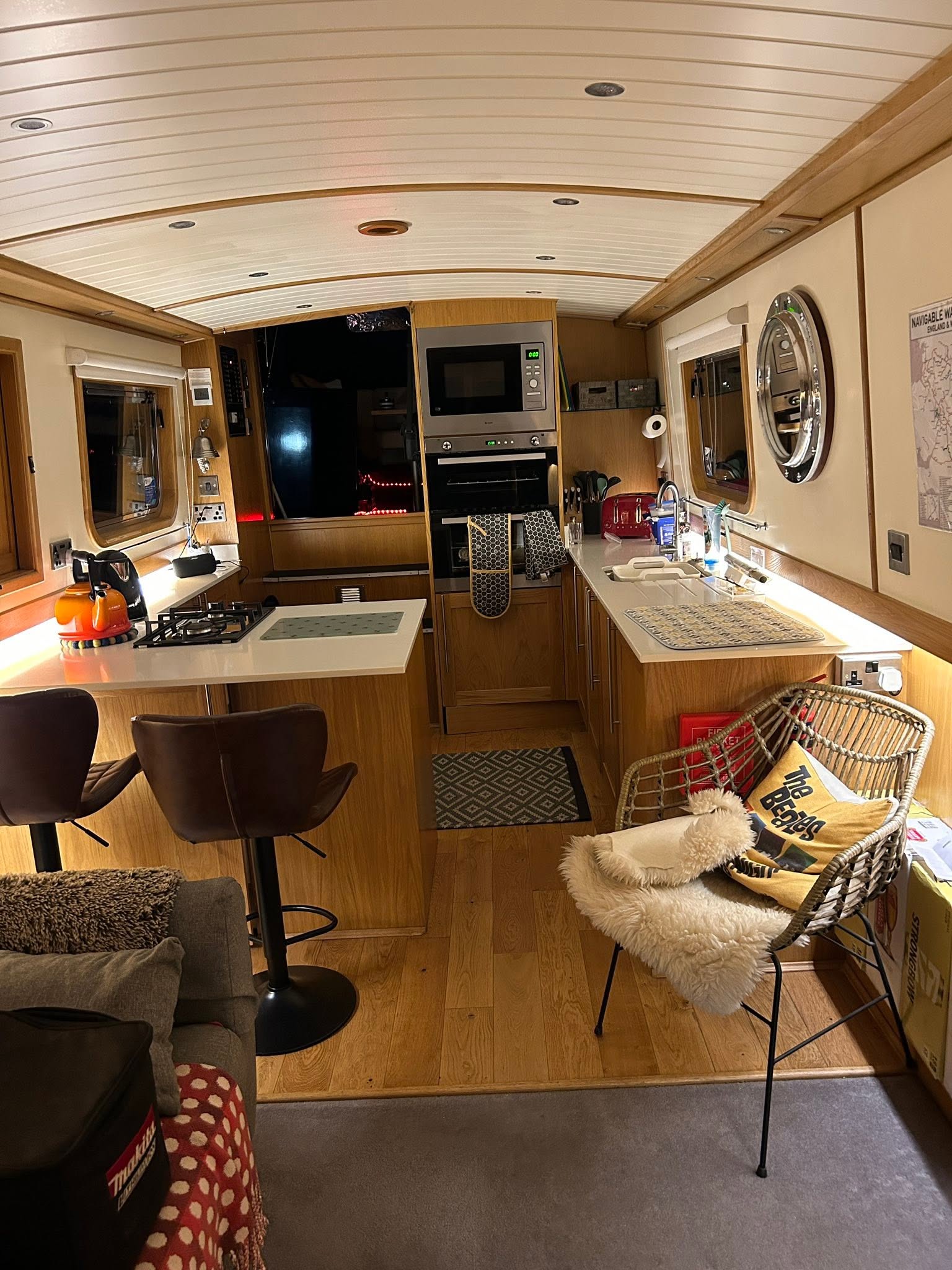 Finished narrowboat kitchen with recessed and under-cabinet lighting